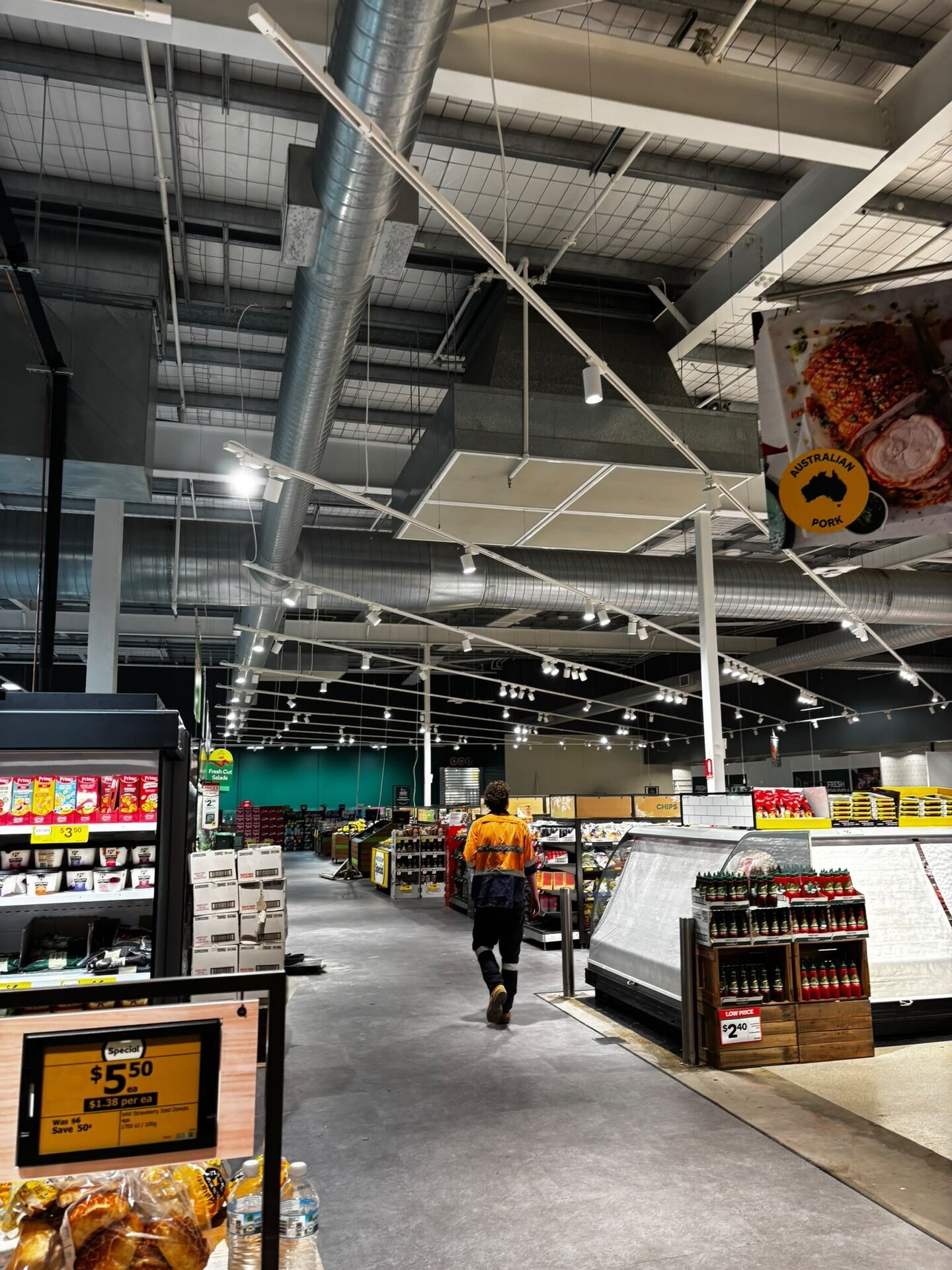 Electricians completing a retail electrical fit-out